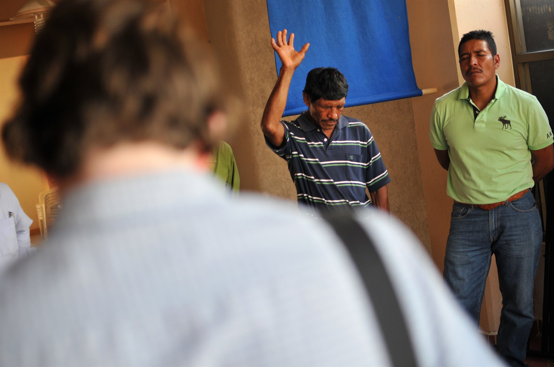 Workers praying in San Juan Ozolotepec
